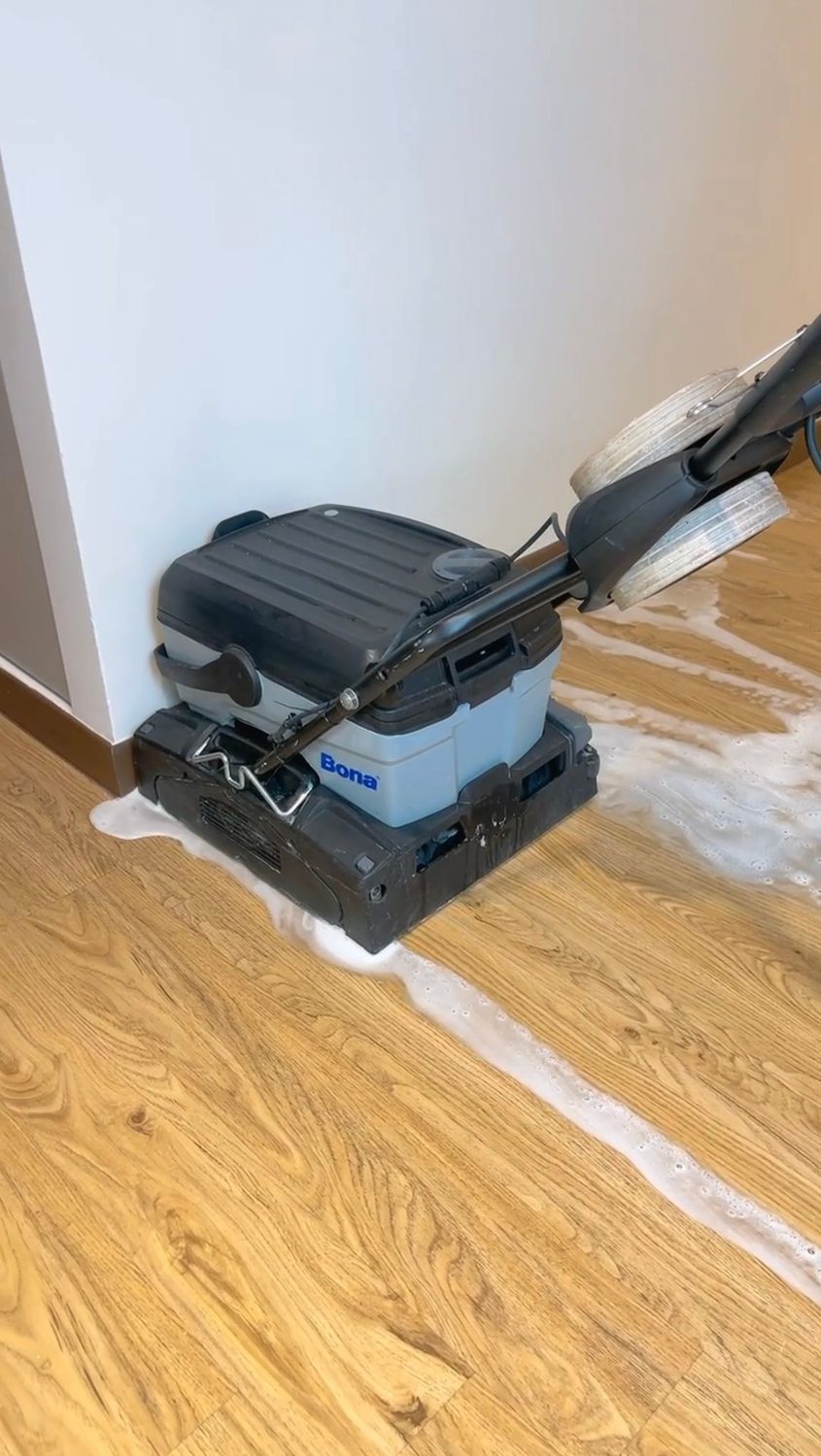 Industrial floor scrubber in action